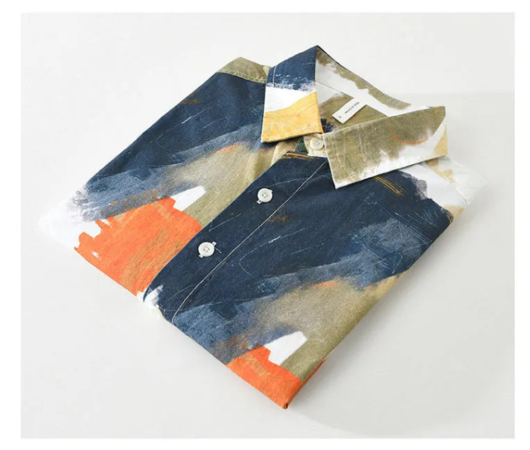 Loose fit cotton cardigan top with long sleeves in a printed colour design, shown on a hanger.