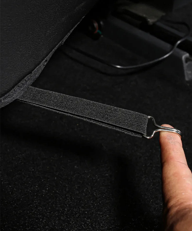 A pair of black leather motorcycle seat kick pads, each with a single pocket.
