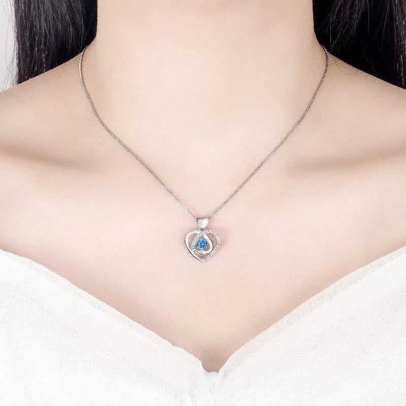 Blue diamond heart pendant necklace and matching bracelet jewellery set with mixed gem inlays