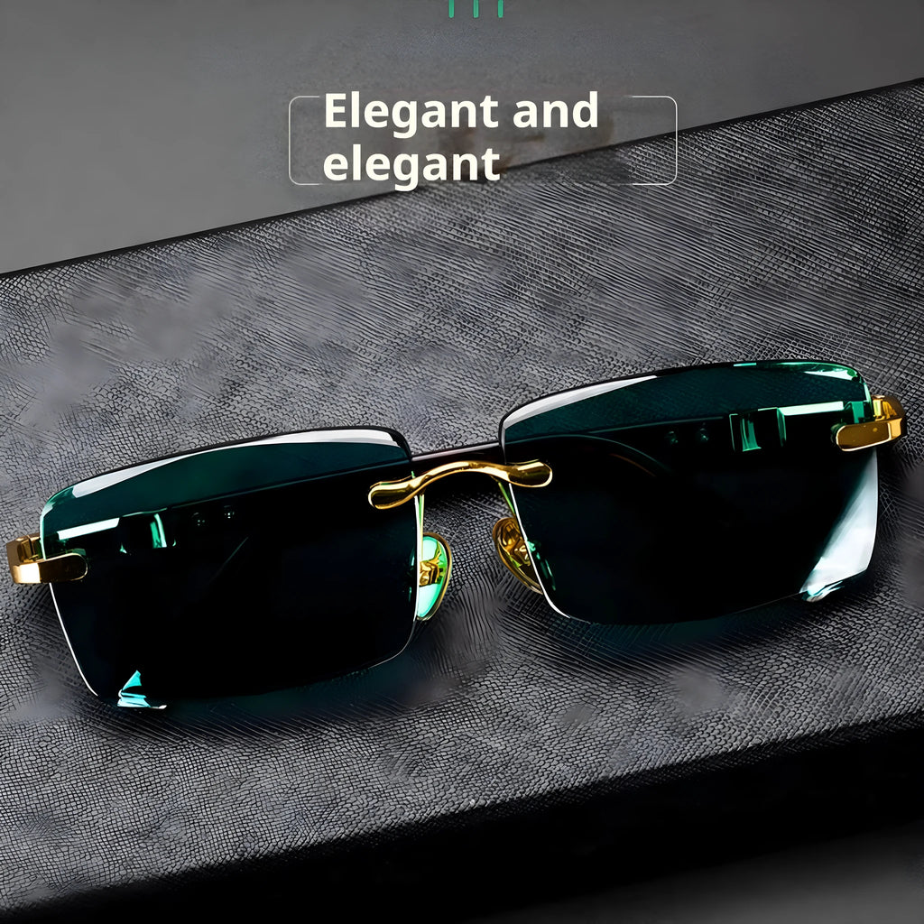 Dark green tinted frameless sunglasses with crystal lenses, shown with a hard protective case and cleaning cloth.