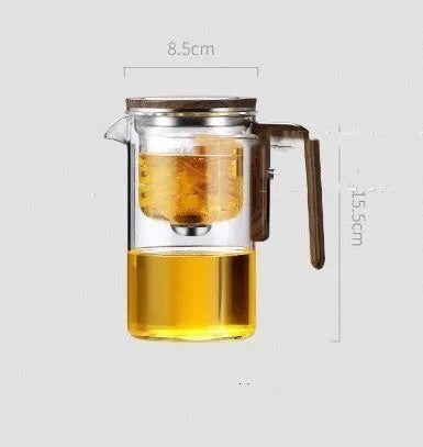 Glass teapot with wooden handle showing magnetic separation inner container and drip-free spout.