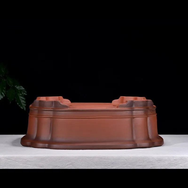 Large antique-style rectangular purple clay flowerpot for garden trees and plants.