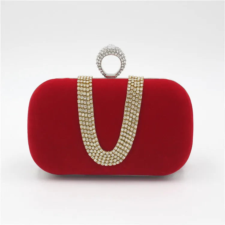 Small velvet evening clutch bag with rhinestones and lock closure, horizontal square shape, available in multiple colours.