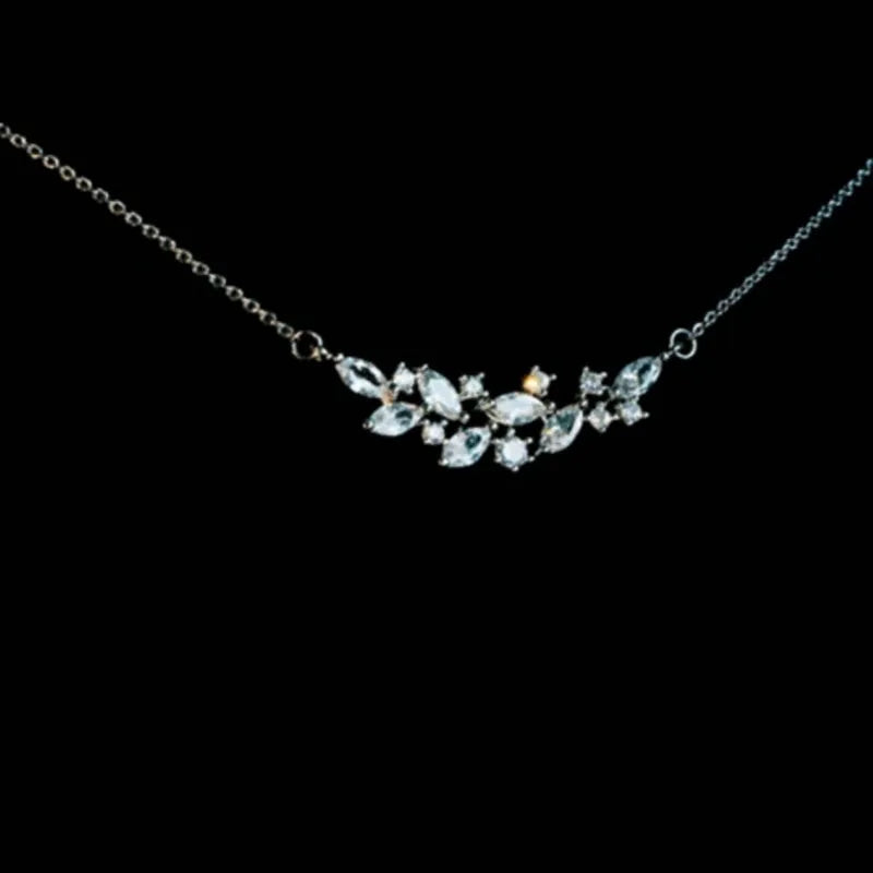 Silver alloy necklace and earrings set with zircon leaf design for bridal weddings