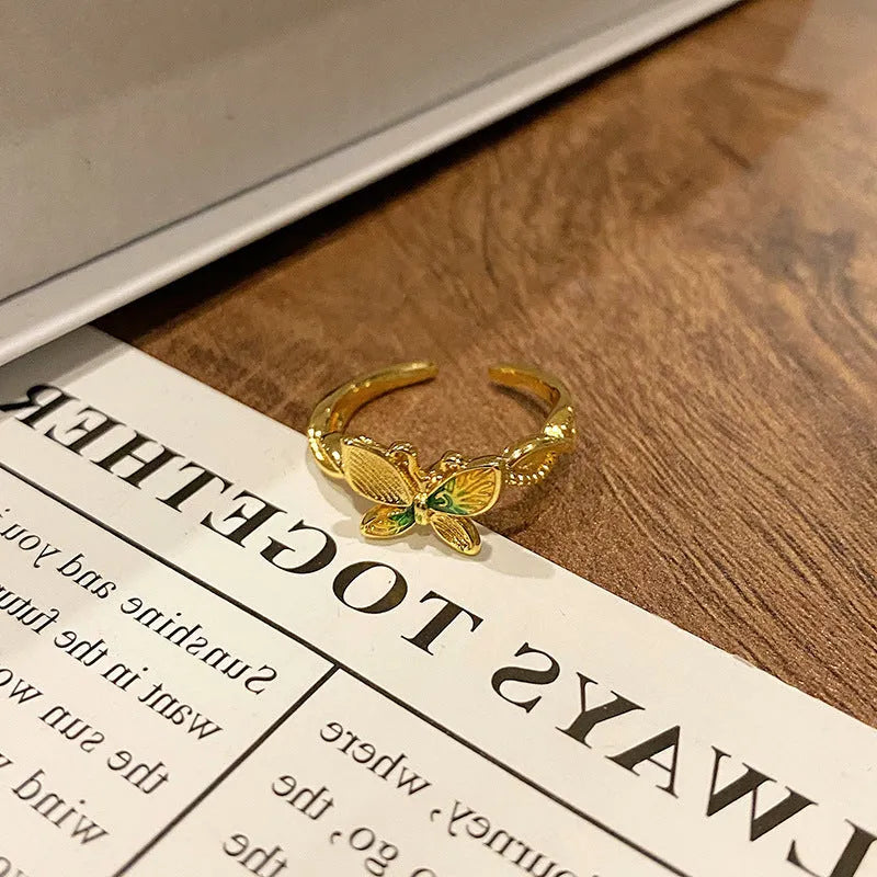 Simple copper women's ring with a Chinese butterfly design, showing an example from the 33 available numbered styles.