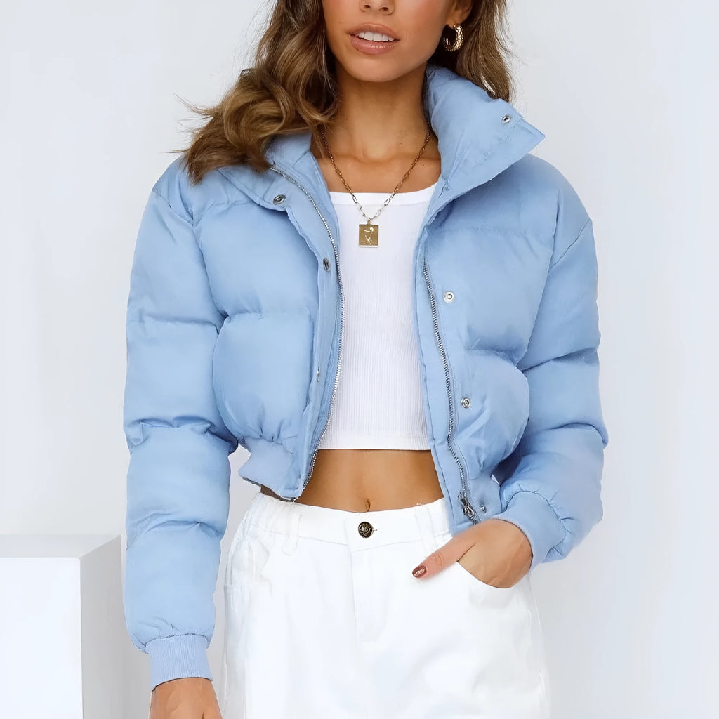 A woman's loose-fitting long sleeve polyester jacket in a casual style, shown in a blue colour variant.