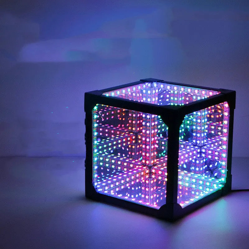 Thousand Mirrors 3D magic cube RGB LED lamp in black with remote control on desk
