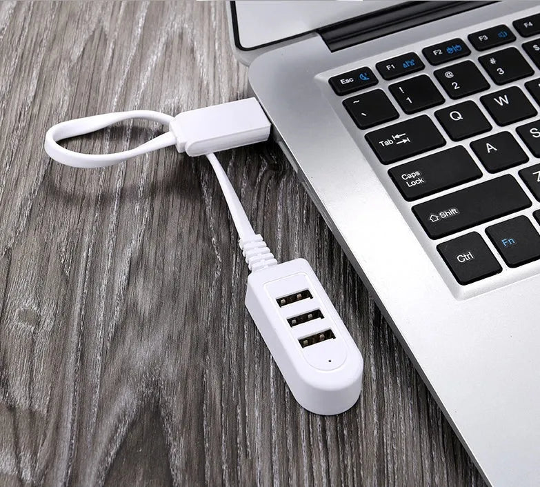 Cable separator hub with 3 USB ports and Micro USB interface on a desk