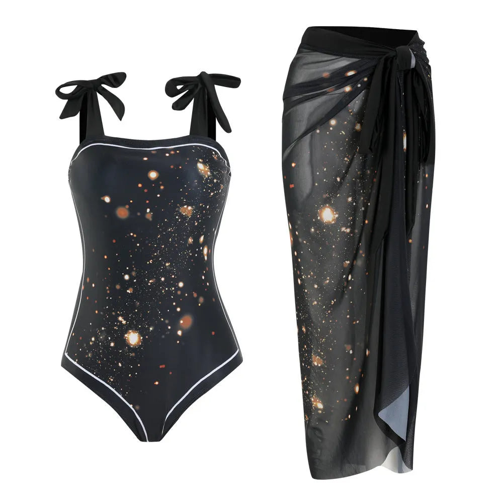 Floral print conservative one-piece swimsuit with mesh tube top and matching skirt.
