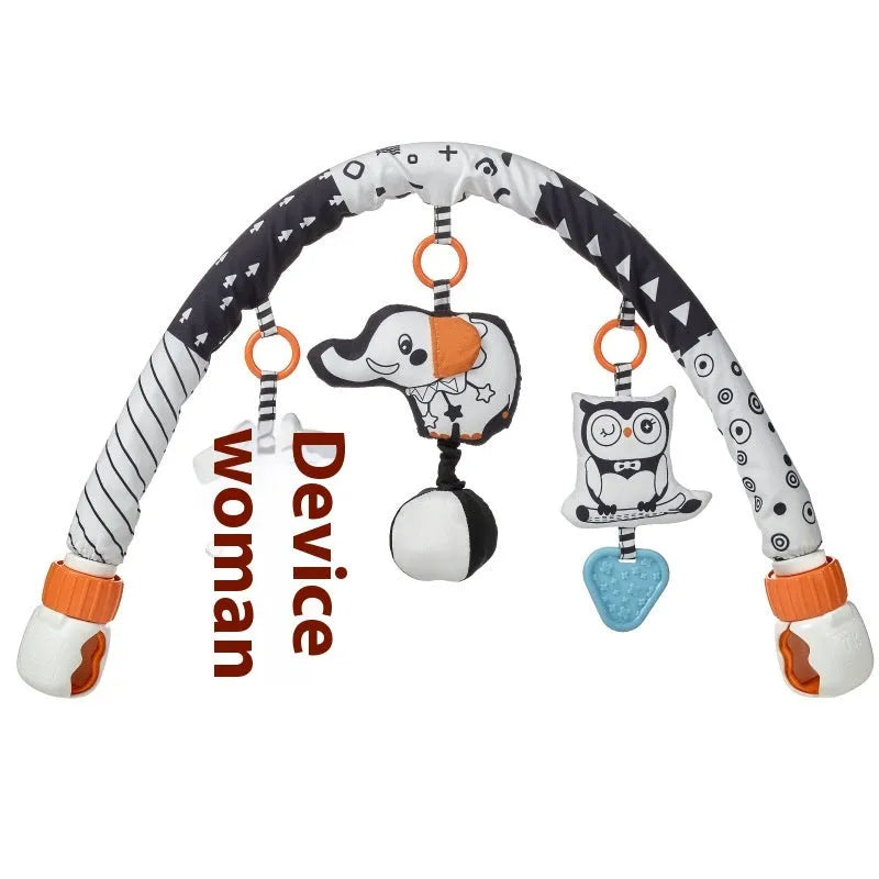 Baby lathe clip hanging plush toy in black and white, with pull vibration teether and BB call, attached to a cot side