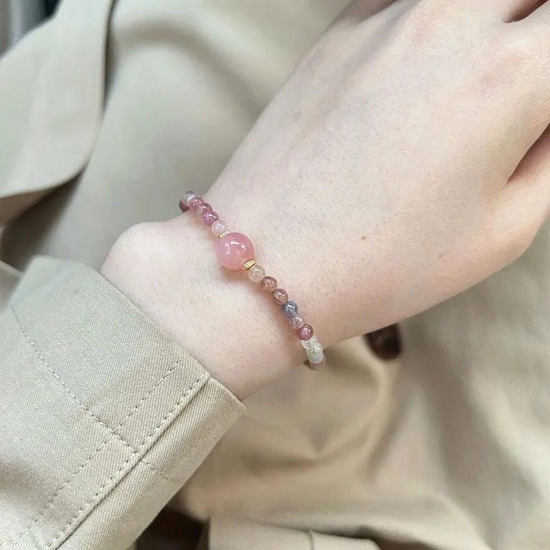 Pink crystal women's bracelet with geometric shape and electroplated finish in colour option selection.