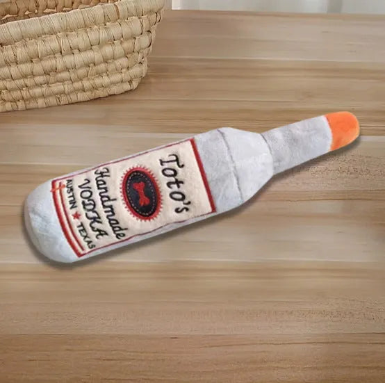 Brown wine bottle shaped plush dog chew toy for dental care and interactive play