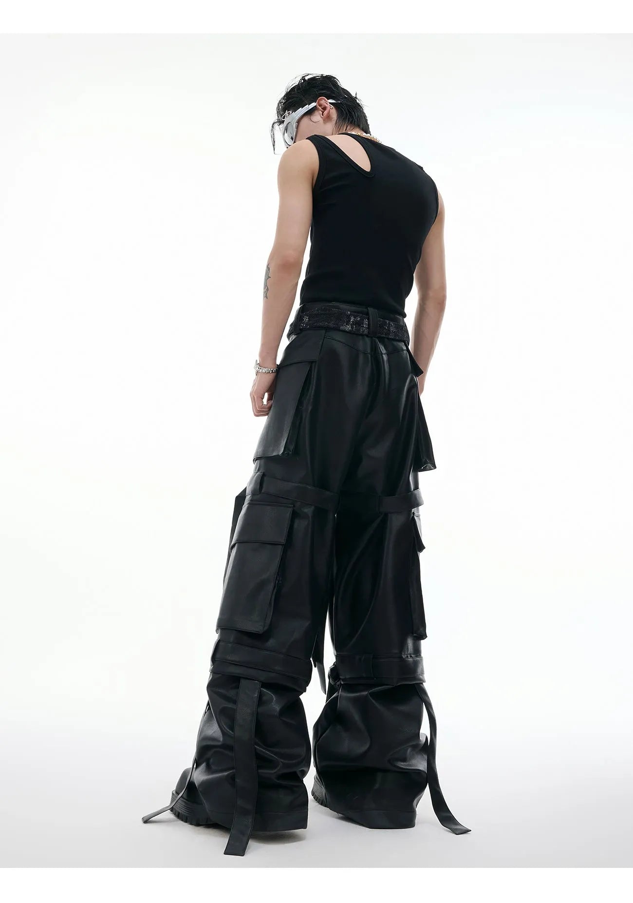 Black retro loose-fit trousers with multiple pockets and quilted leather-look fabric.