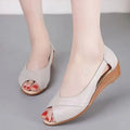 Women's casual peep toe mid heel sandals in black with ankle buckle and rubber sole