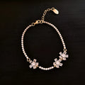 Gold-coloured women's copper bracelet with geometric design and zircon inlay detailing