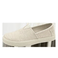 Men's beige linen canvas slip-on shoes with round toe and shallow cut design on a grey background.