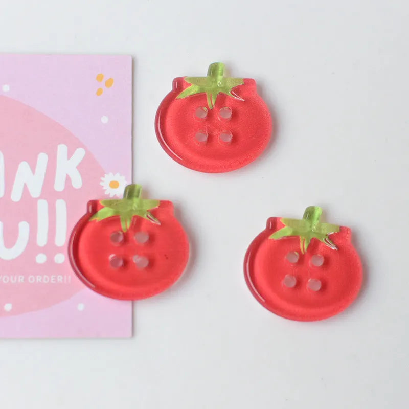 Medium tomato-themed plastic buttons in red colour variations including cherry tomato printing and solid red