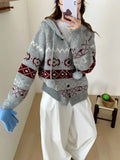 Plus size woman wearing a loose milky white geometric brocade sweater coat with long sleeves.