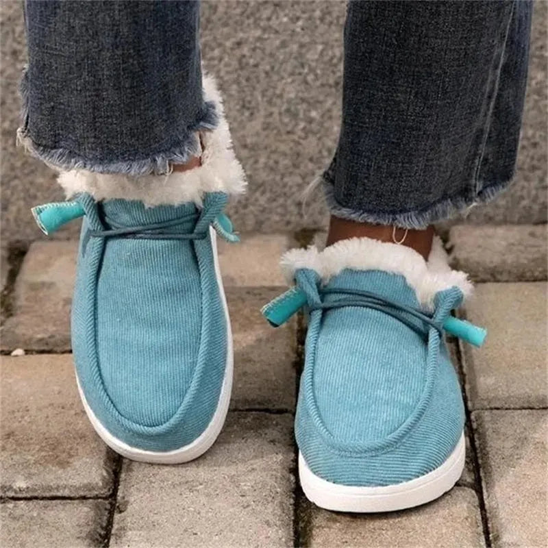 Women's winter snow boots with cotton upper and plush lining in grey, side view showing front-tie lacing and ankle height