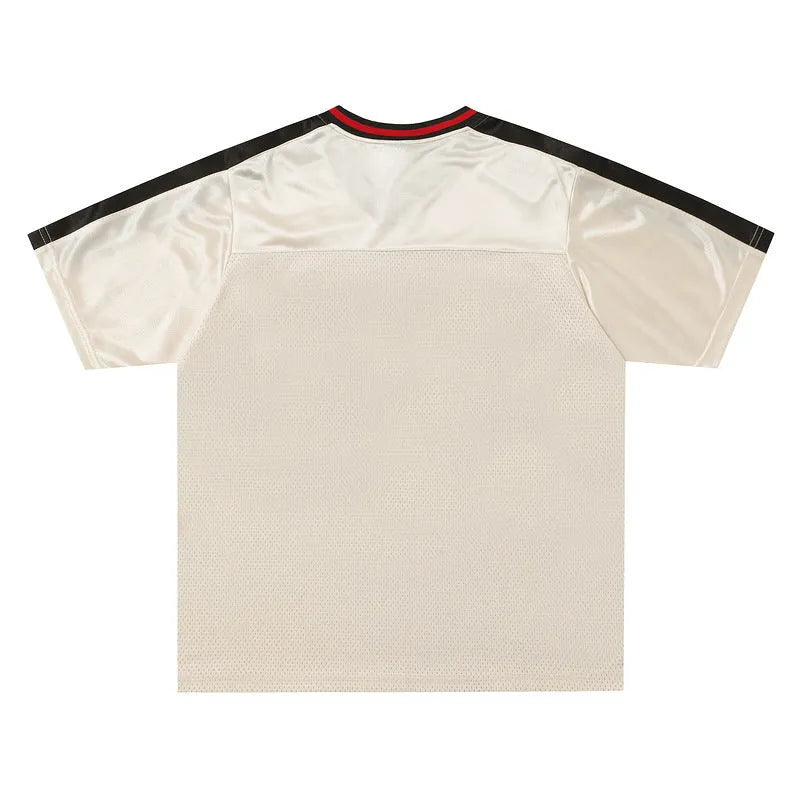 Apricot V-neck pullover top with letter pattern and drop-shoulder sleeves on hanger