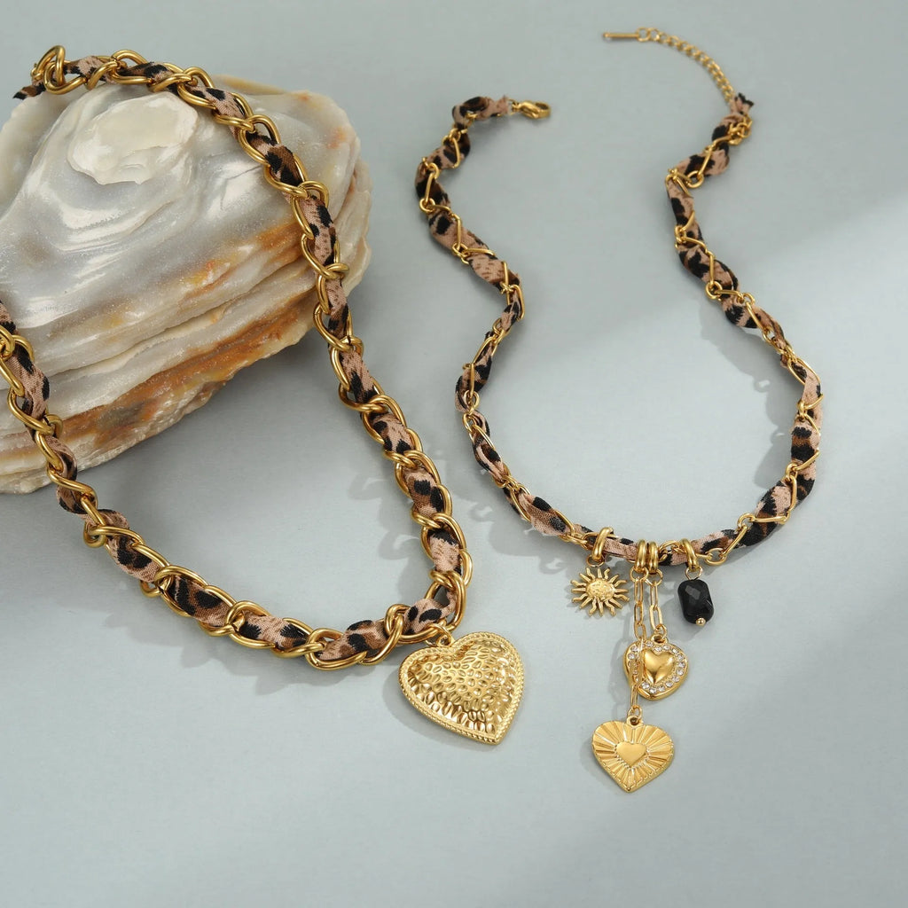 Geometric leopard love pendant necklace on a stainless steel chain with 18K gold electroplate.