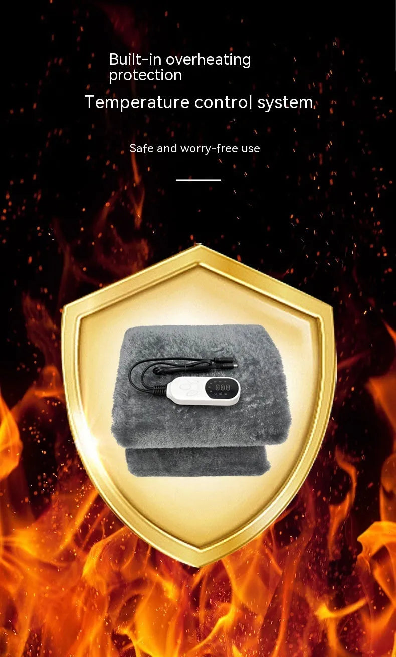 Grey 12v car electric blanket with power cord and controller on a car seat.
