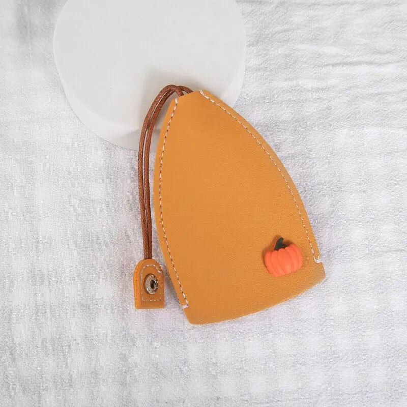 Colourful cartoon and resin design pull-out key case for car keys made from PU leather.