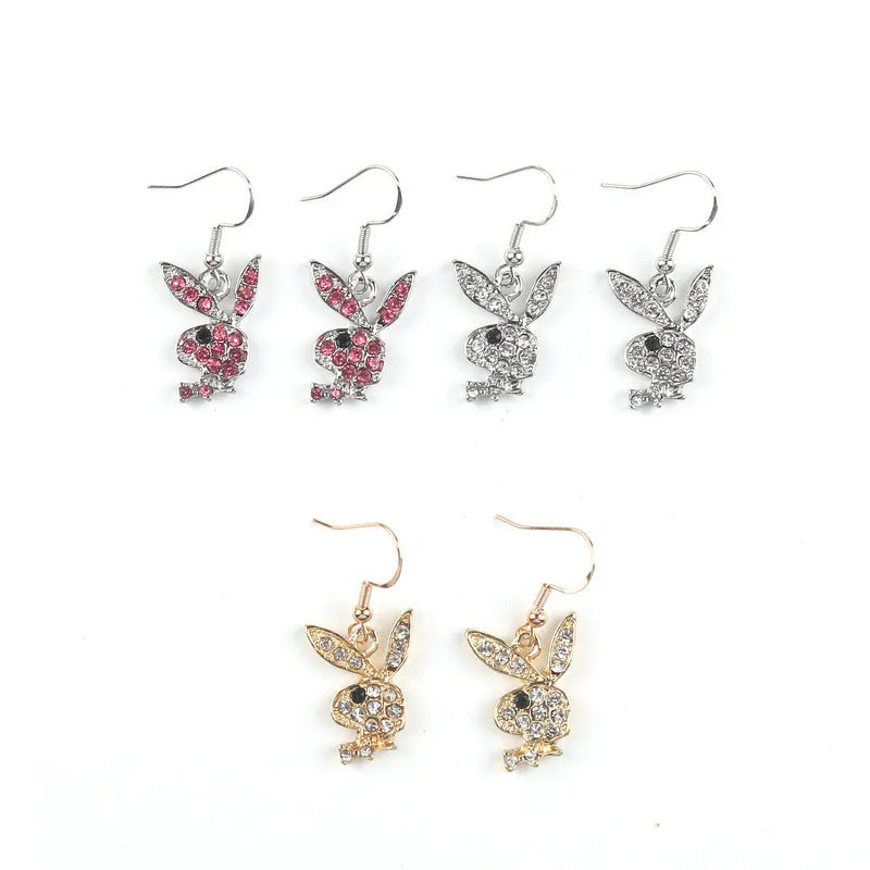 A pair of sparkling rabbit-shaped stud earrings with a full pavé cubic zirconia setting on a silver metal background.