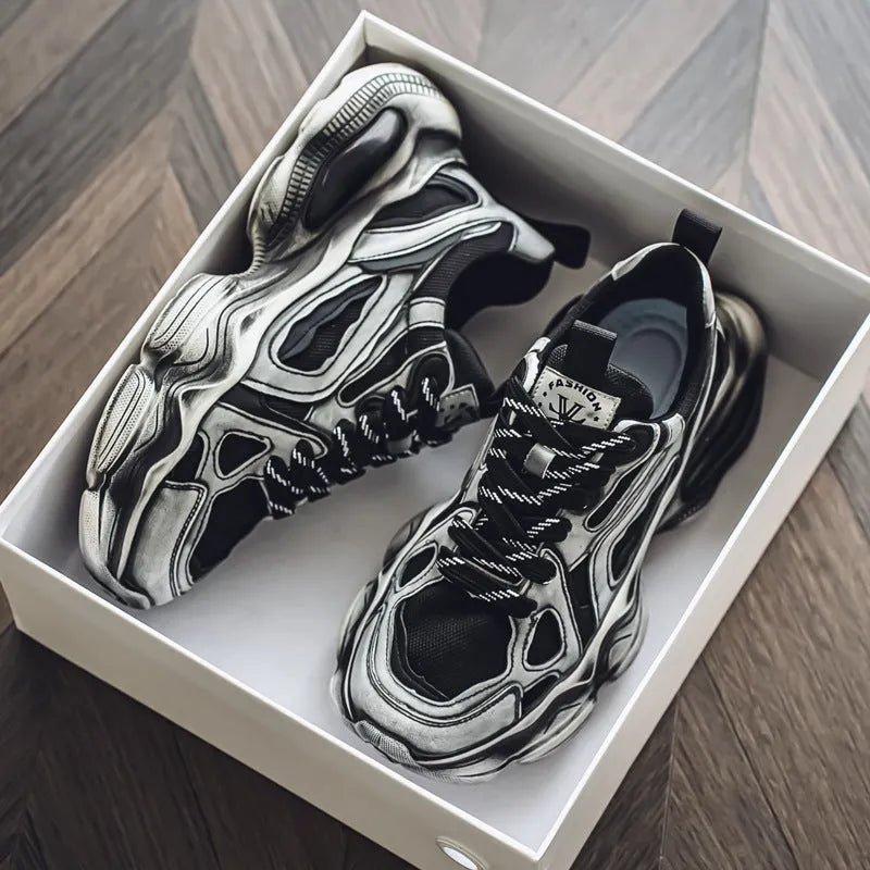 Men's black and white mesh sneakers with a platform sole and lace-up front on a plain background.