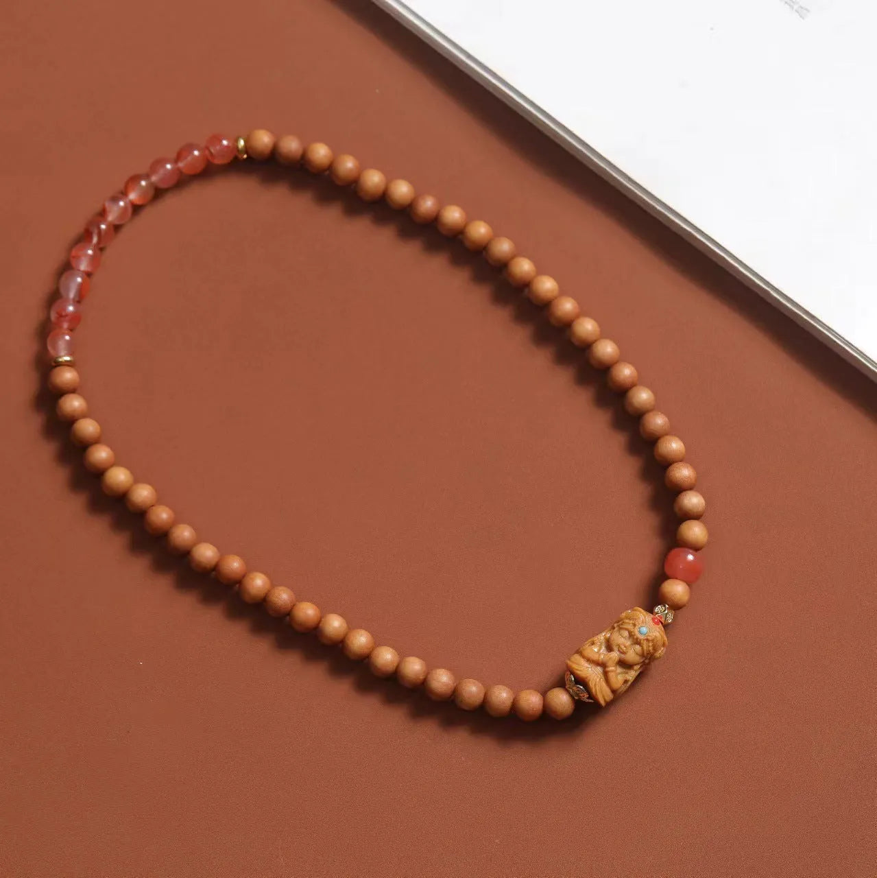Brown wooden double circle bracelet with woven Zachilam pattern and 6mm round beads