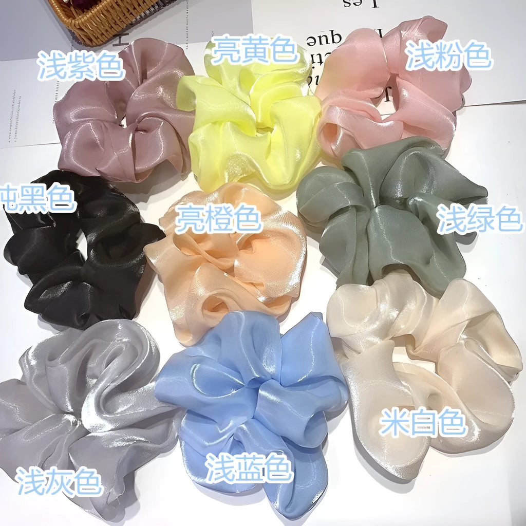 Korean style cloth hair ring with crystal satin finish in light pink colour on a white background