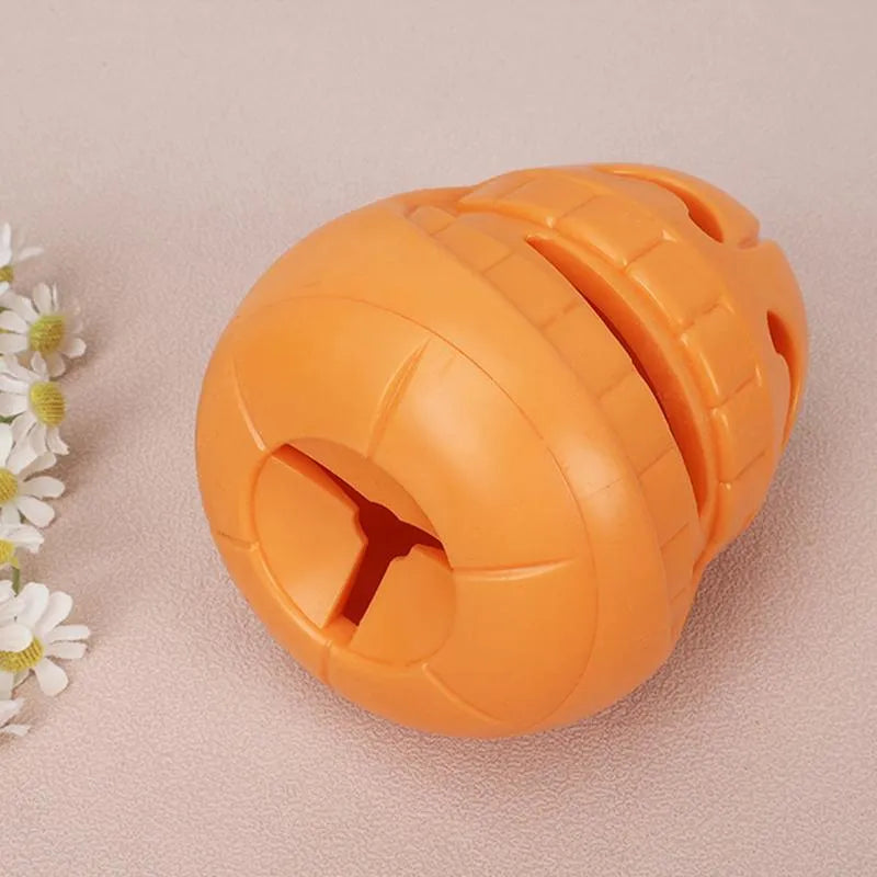 Yellow pumpkin-shaped TPR dog chew toy for aggressive chewers.