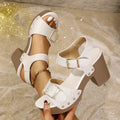 Plus size beige high heel sandals with a buckle strap and fish mouth toe design on a rubber sole.