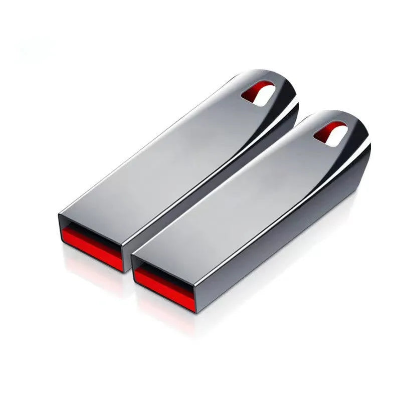Silver metal USB flash drive with large capacity up to 2TB shown on a dark background