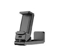 Universal foldable rotating phone holder in black, grey and green colours on a table.