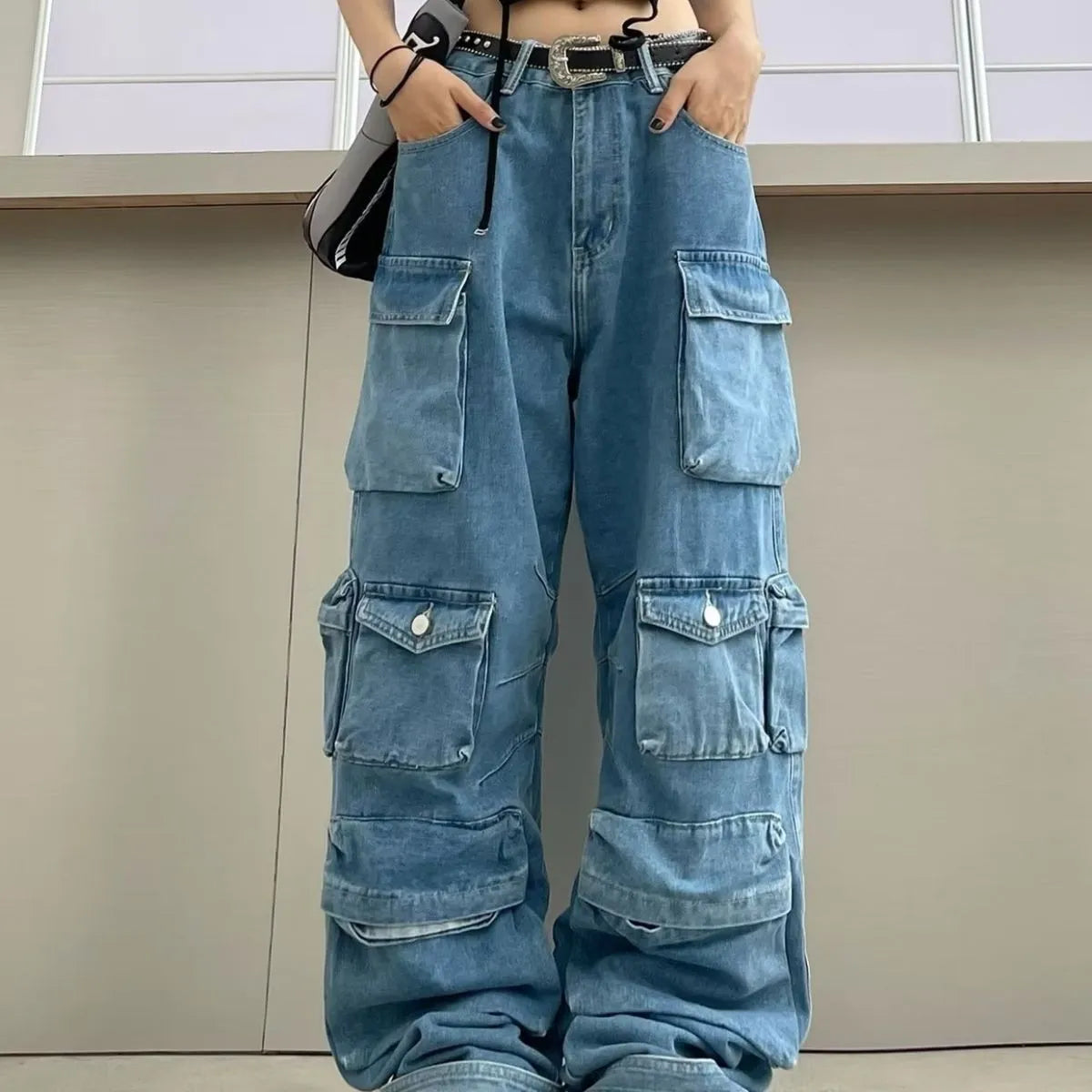 Women's high waist tie-dyed denim trousers with wide leg silhouette and multiple pockets in street hipster style