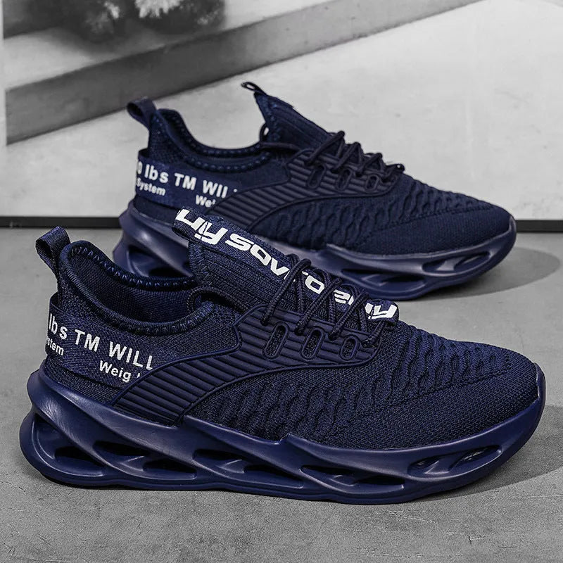 Women's FlyKnit mesh casual trainers in black, showing round toe and flat heel design.