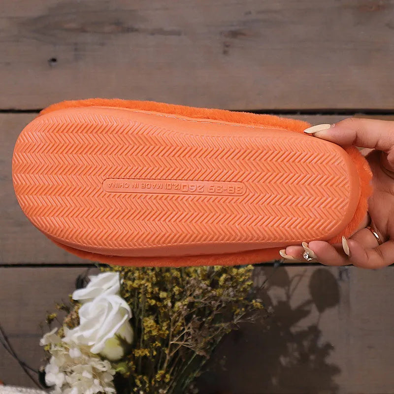 Orange pumpkin-shaped plush slippers with coral velvet upper on a non-slip PVC sole