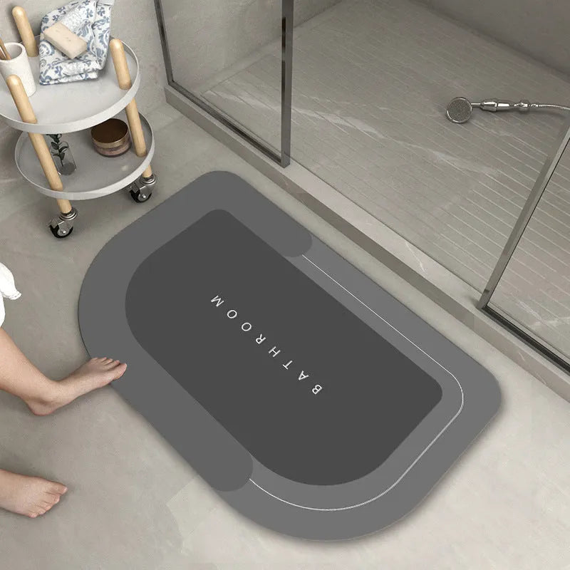 Blended material bathroom floor mat in oval and rectangle shapes on a tiled floor.