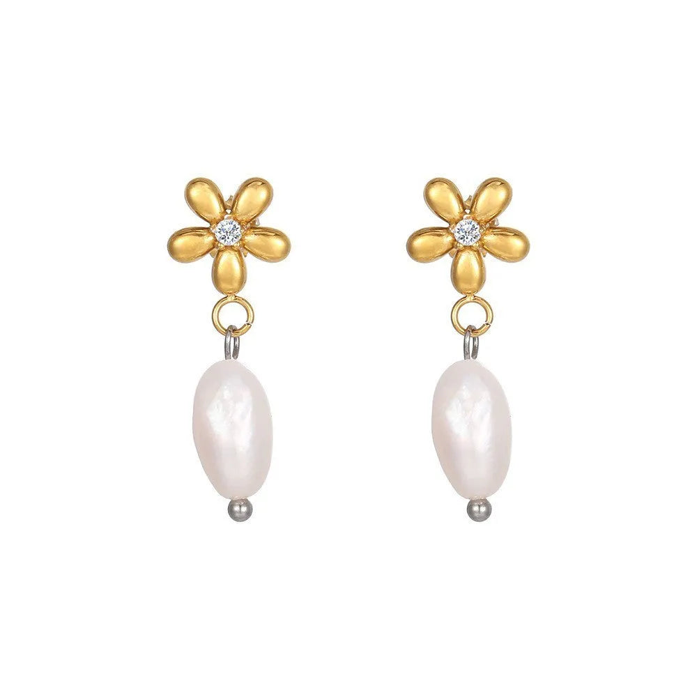Women's gold titanium steel C-shaped earrings with pearl inlay flower design on white background