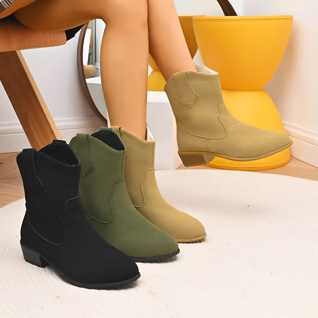 Pointed British style mid heel boots in black PU upper with rubber sole