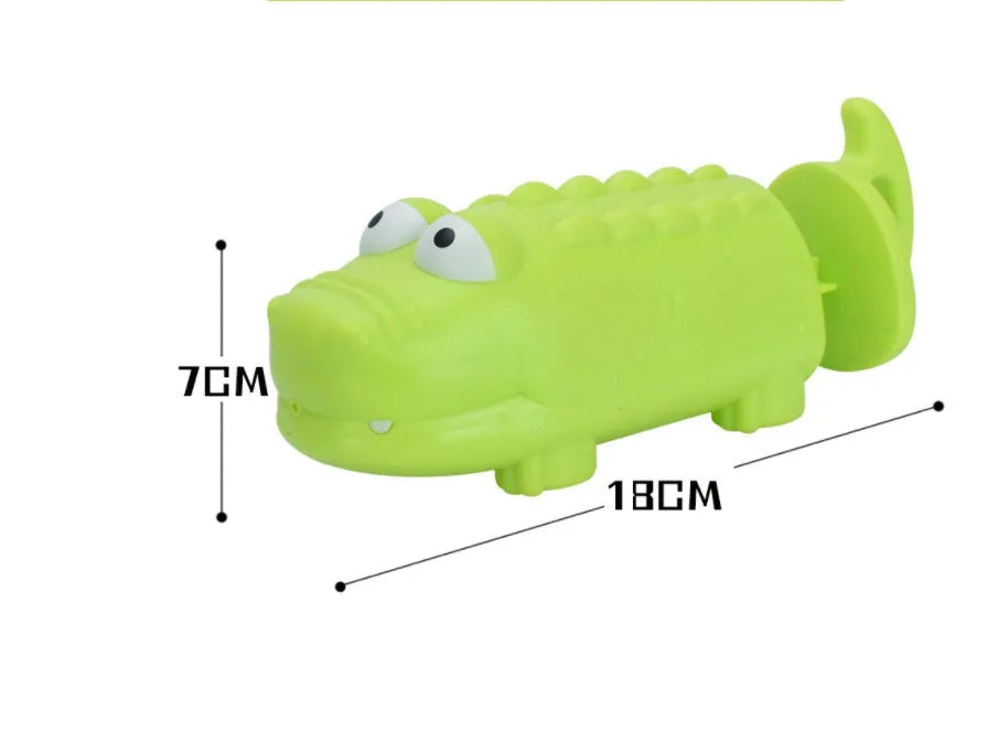 Children's plastic dinosaur water gun bath toy in blue, green, orange, pink, or sky blue, supplied in an OPP bag.