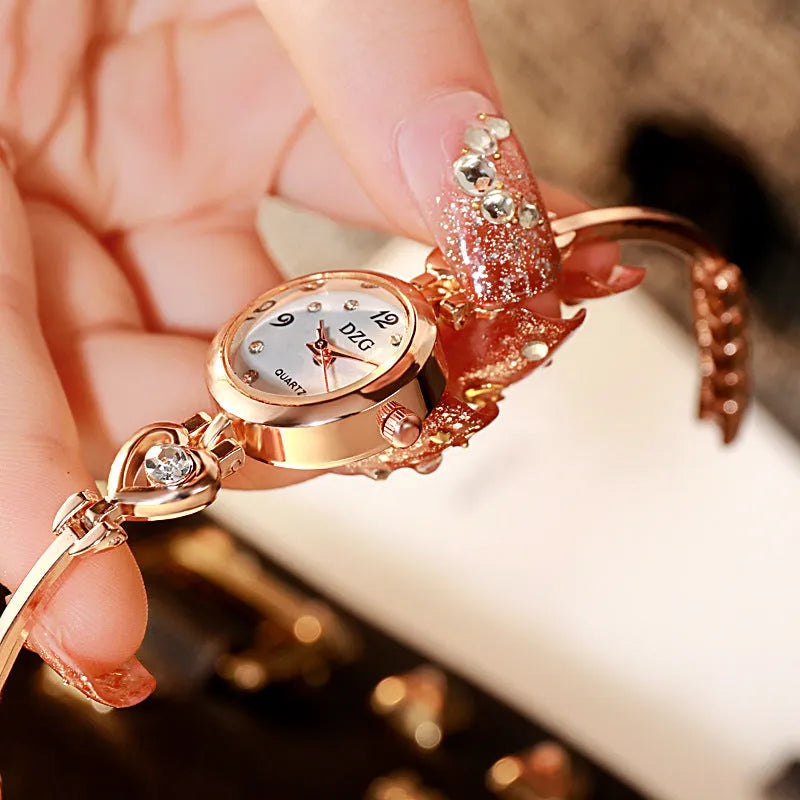 Women's simple rhinestone casual square watch with gold alloy strap and stainless steel buckle on white background