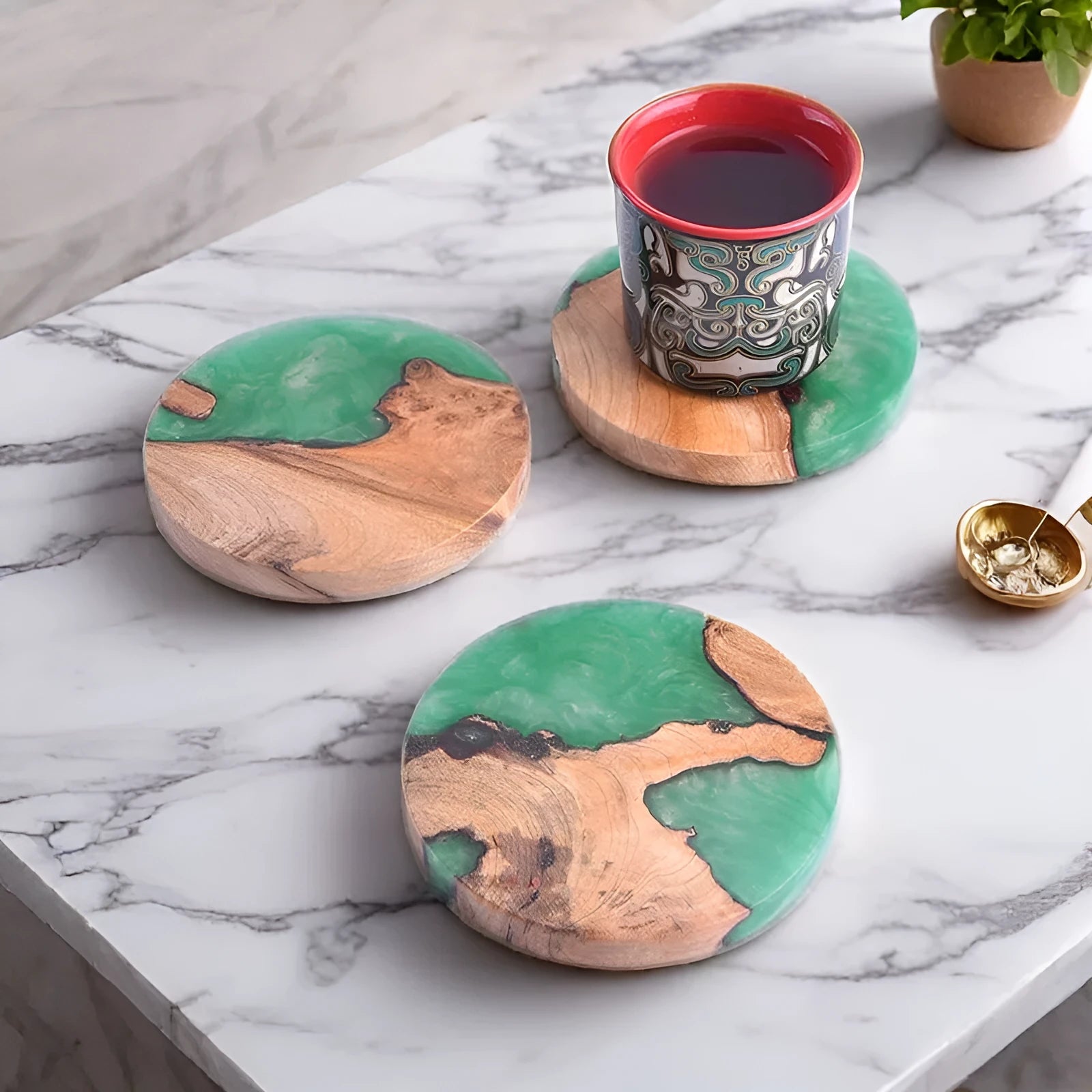 A solid colour resin coaster on a wooden table, showing its 1cm thickness and irregular Nordic shape.