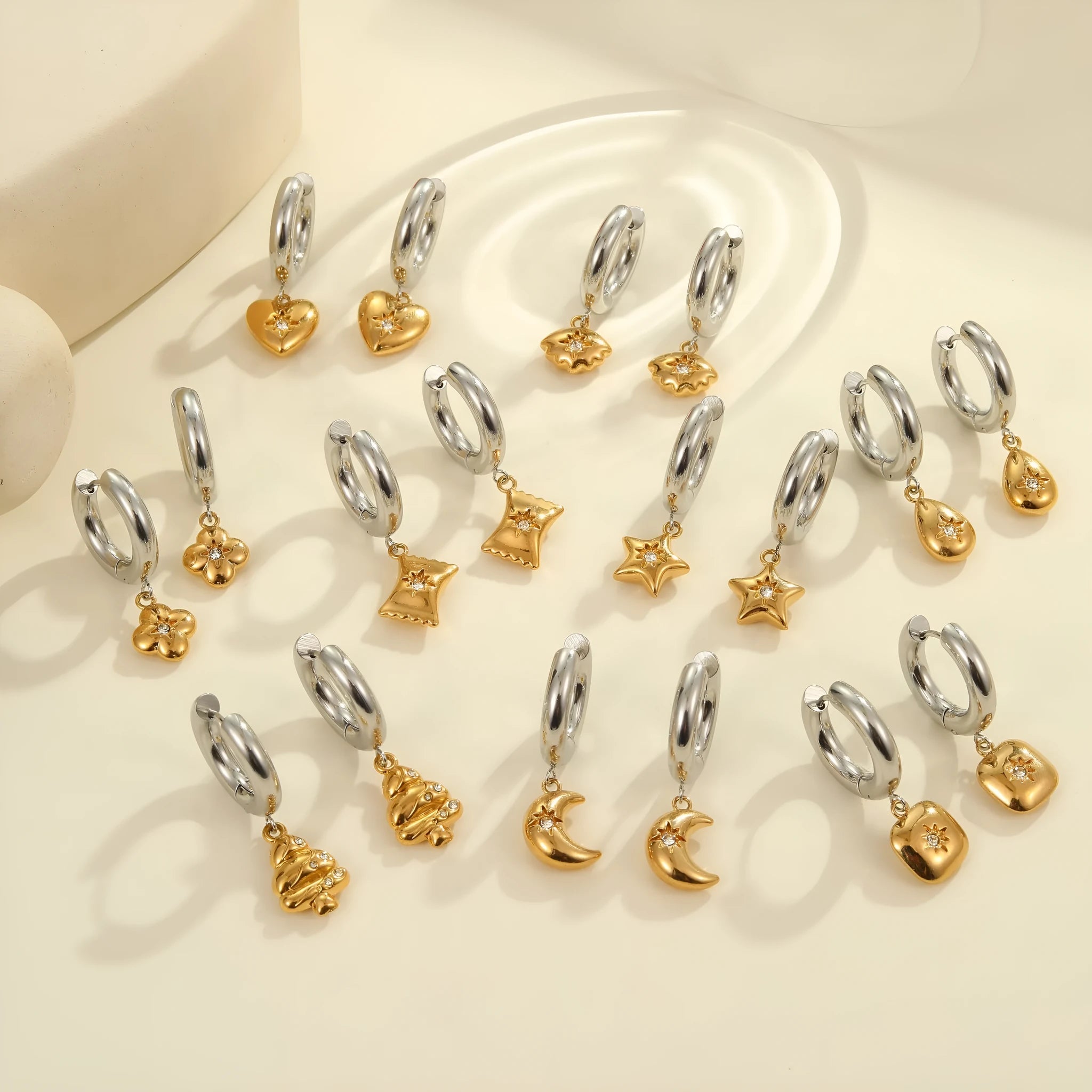 Women's stainless steel Christmas tree and heart earrings with electroplated finish showing geometric shapes