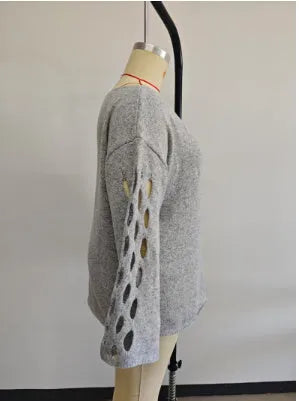 Women's solid color round neck long sleeve hollow sweater pullover in gray, front view