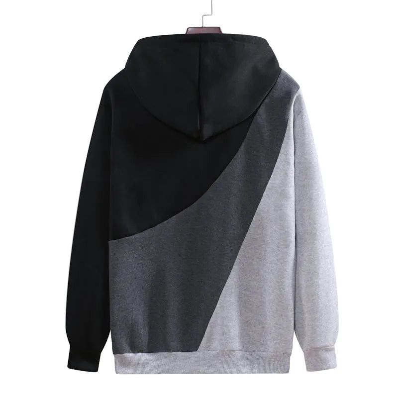 Casual men's loose hooded pullover sweater in blue-white with geometric colour-blocked stitching and save pockets