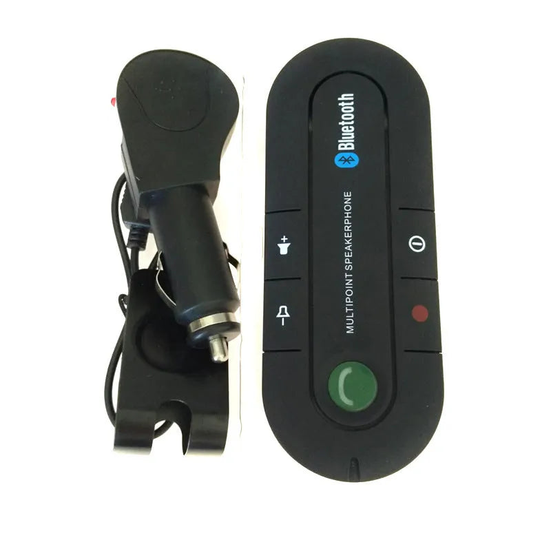 Black vehicle-mounted Bluetooth handsfree and music player device attached to a car sun visor.