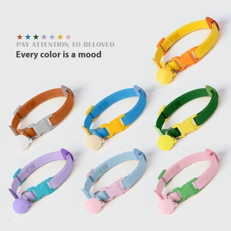 Small elastic dog collar in dark blue, stretched to show flexibility on a measuring tape from 22 to 32 cm.