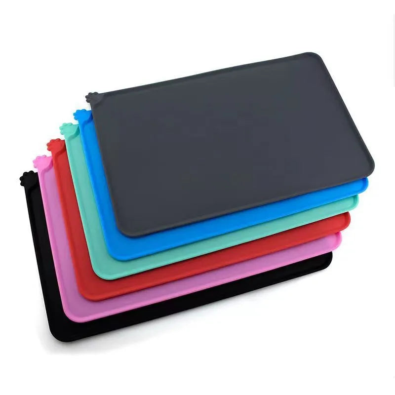 Silicone pet feeding placemat under a dog bowl, shown in one of five available colours.